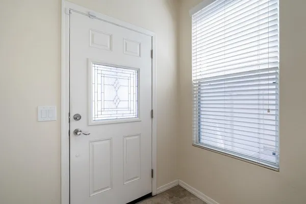 a kitchen with stainless steel appliances granite countertop white cabinets a sink and dishwasher with wooden floor