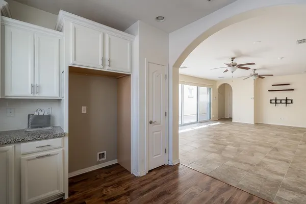 a kitchen with granite countertop a sink and a window
