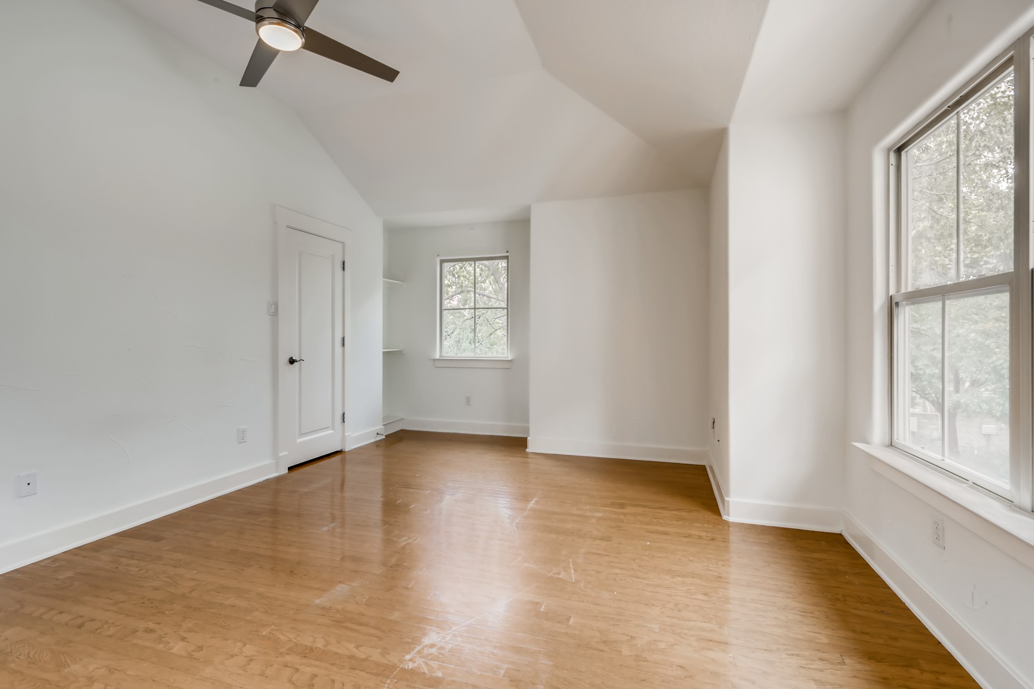 2800 Waymaker Way, Unit 27 Austin, TX 78746 - Photo 14 of 17 Spare room featuring ceiling fan, light wood-type flooring, and lofted ceiling