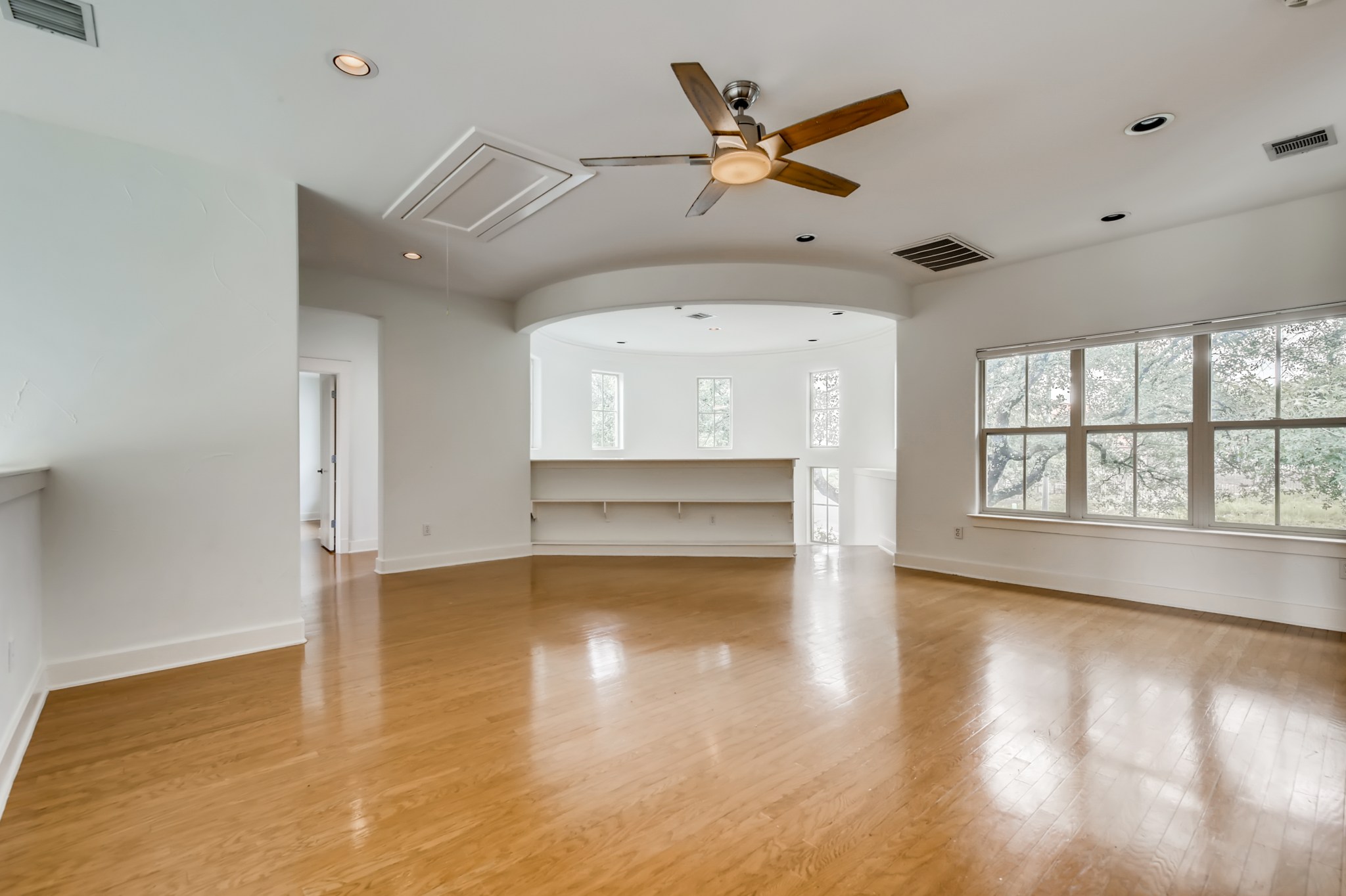 2800 Waymaker Way, Unit 27 Austin, TX 78746 - Photo 15 of 17 Unfurnished living room featuring ceiling fan, light wood finished floors, and recessed lighting