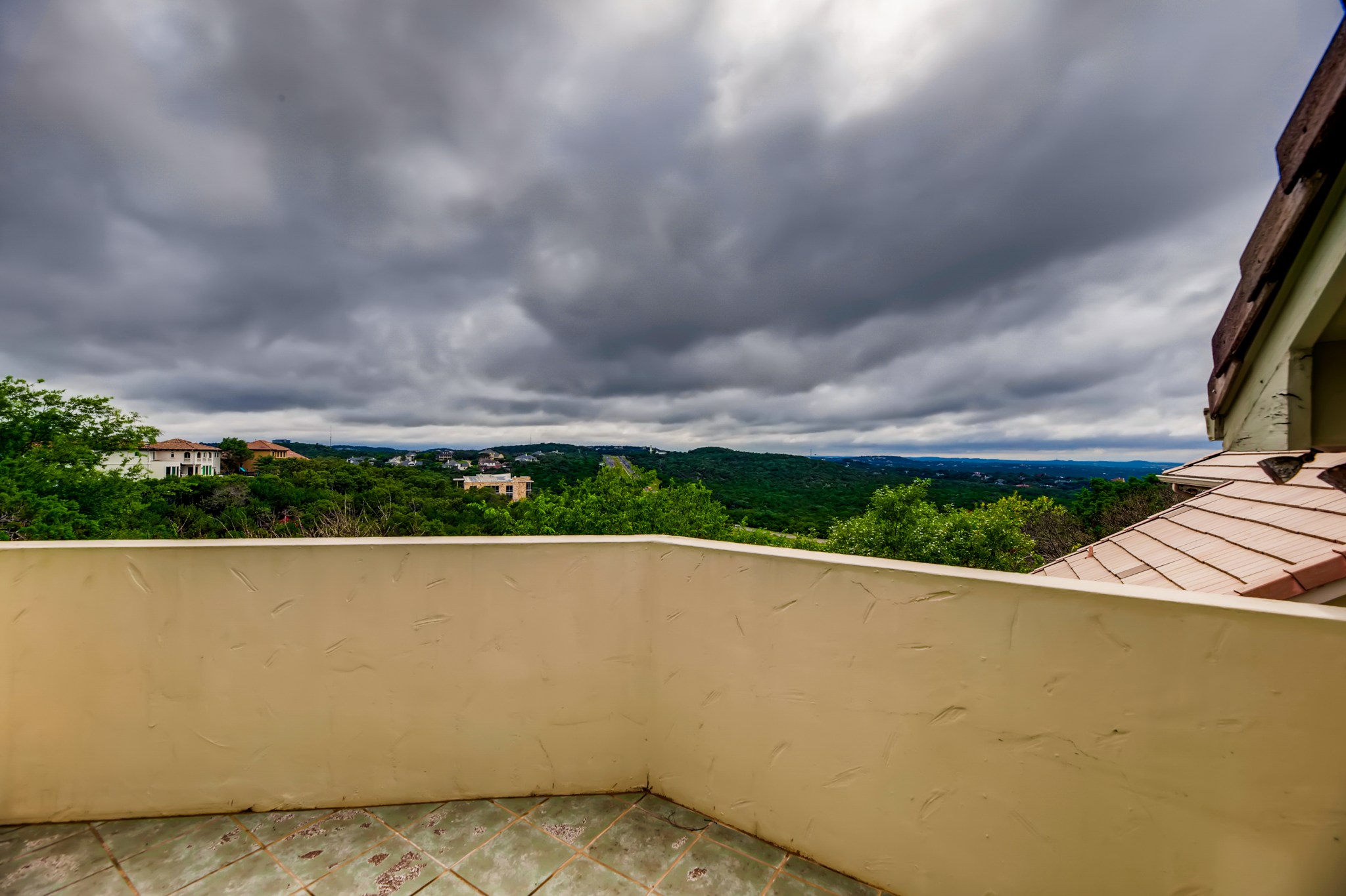 2800 Waymaker Way, Unit 27 Austin, TX 78746 - Photo 17 of 17 Balcony featuring a forest view