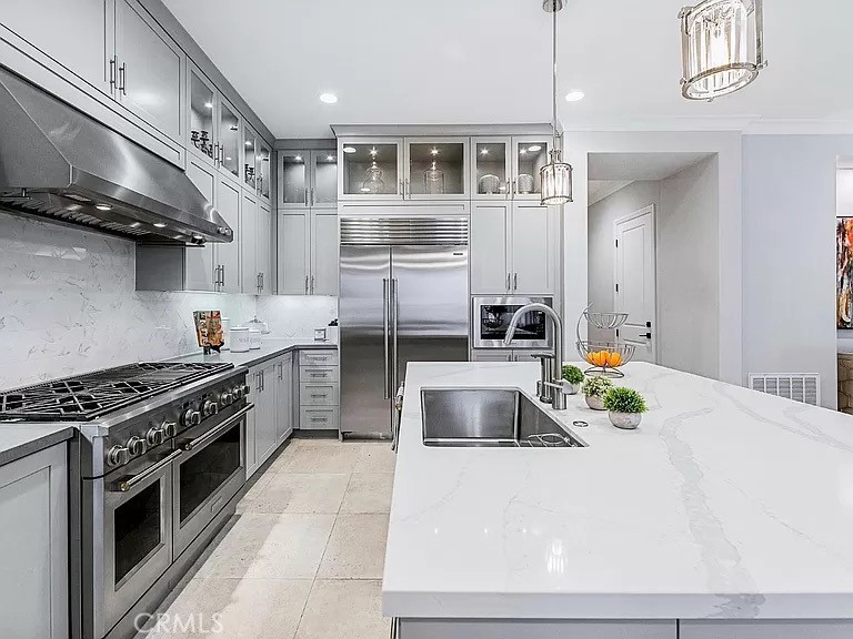 65 Rockinghorse Irvine, CA 92602 - Photo 12 of 45 a kitchen with stainless steel appliances a stove a sink and a microwave