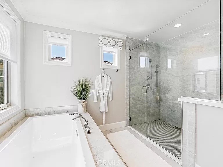 65 Rockinghorse Irvine, CA 92602 - Photo 27 of 45 a bathroom with a tub shower and sink