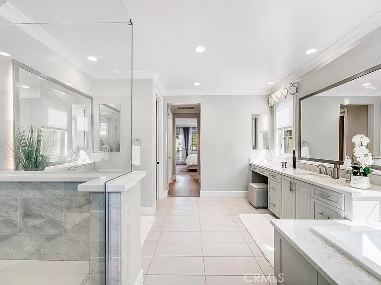 65 Rockinghorse Irvine, CA 92602 - Photo 28 of 45 a large white kitchen with a large window