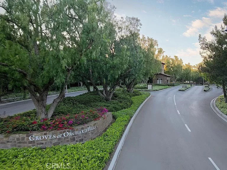 65 Rockinghorse Irvine, CA 92602 - Photo 36 of 45 a view of a road with a fountain in the background