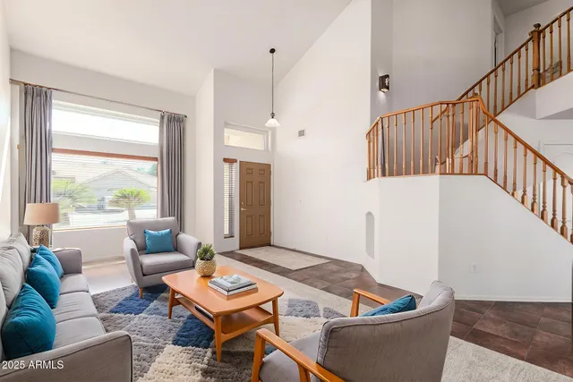 a living room with furniture and a table