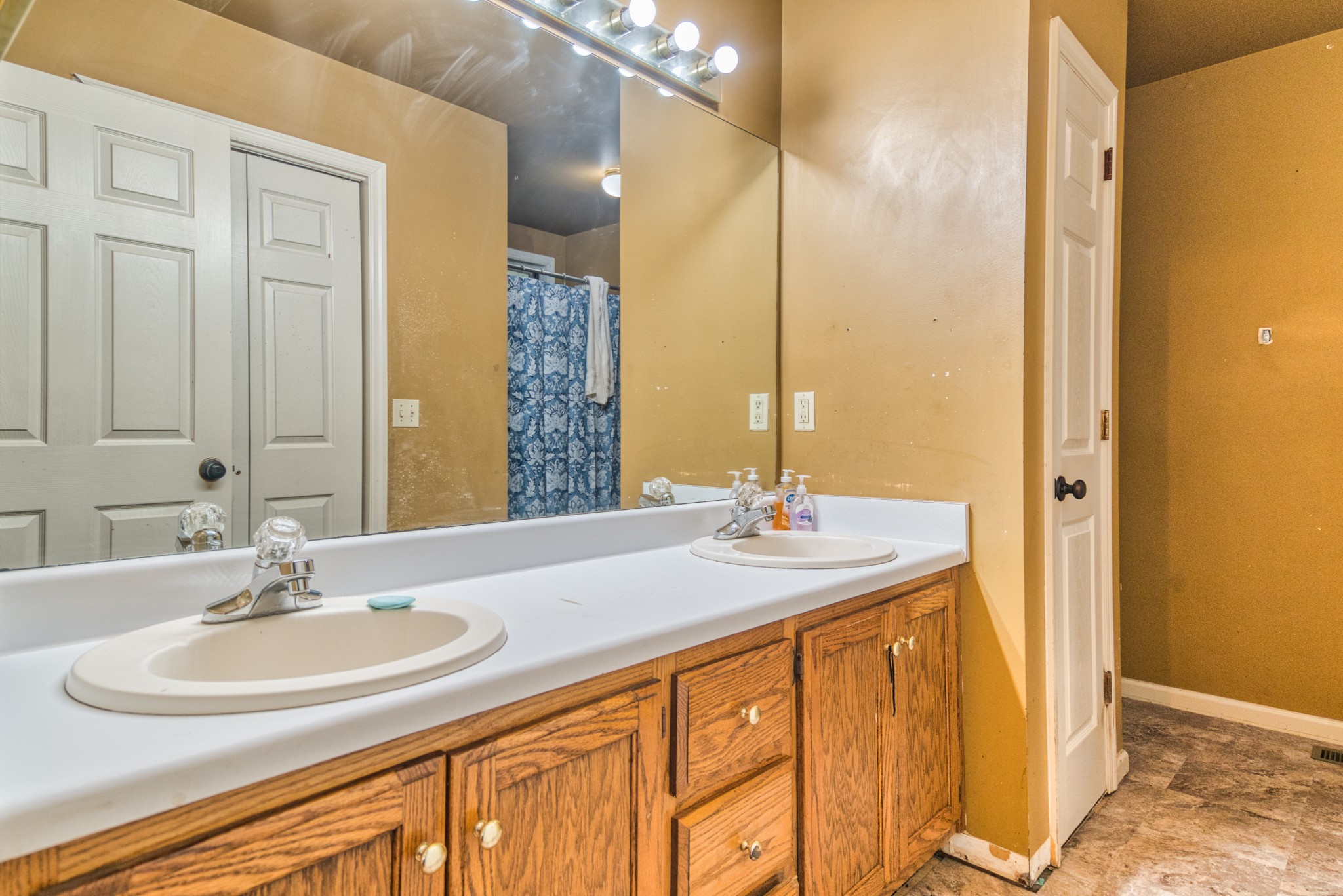 190 Rose Street Greenbrier, TN 37073 - Photo 12 of 32 a bathroom with a sink and a mirror
