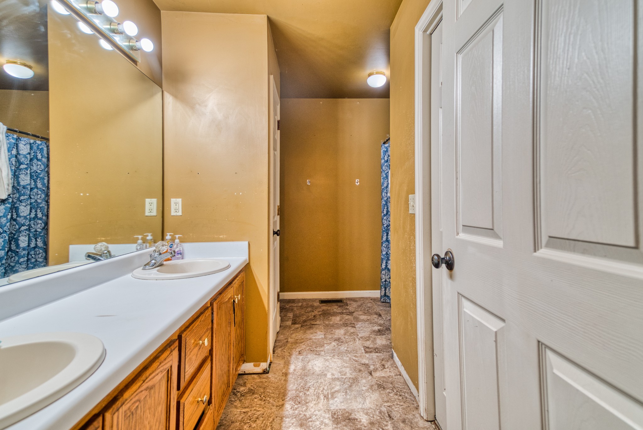 190 Rose Street Greenbrier, TN 37073 - Photo 13 of 32 a bathroom with a granite countertop sink and a mirror