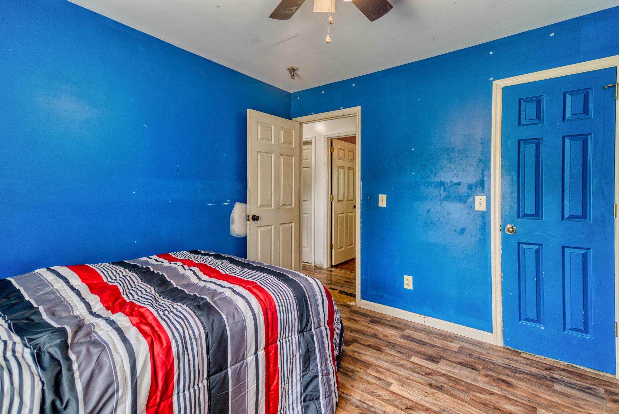 190 Rose Street Greenbrier, TN 37073 - Photo 15 of 32 a bedroom with a bed and a chandelier