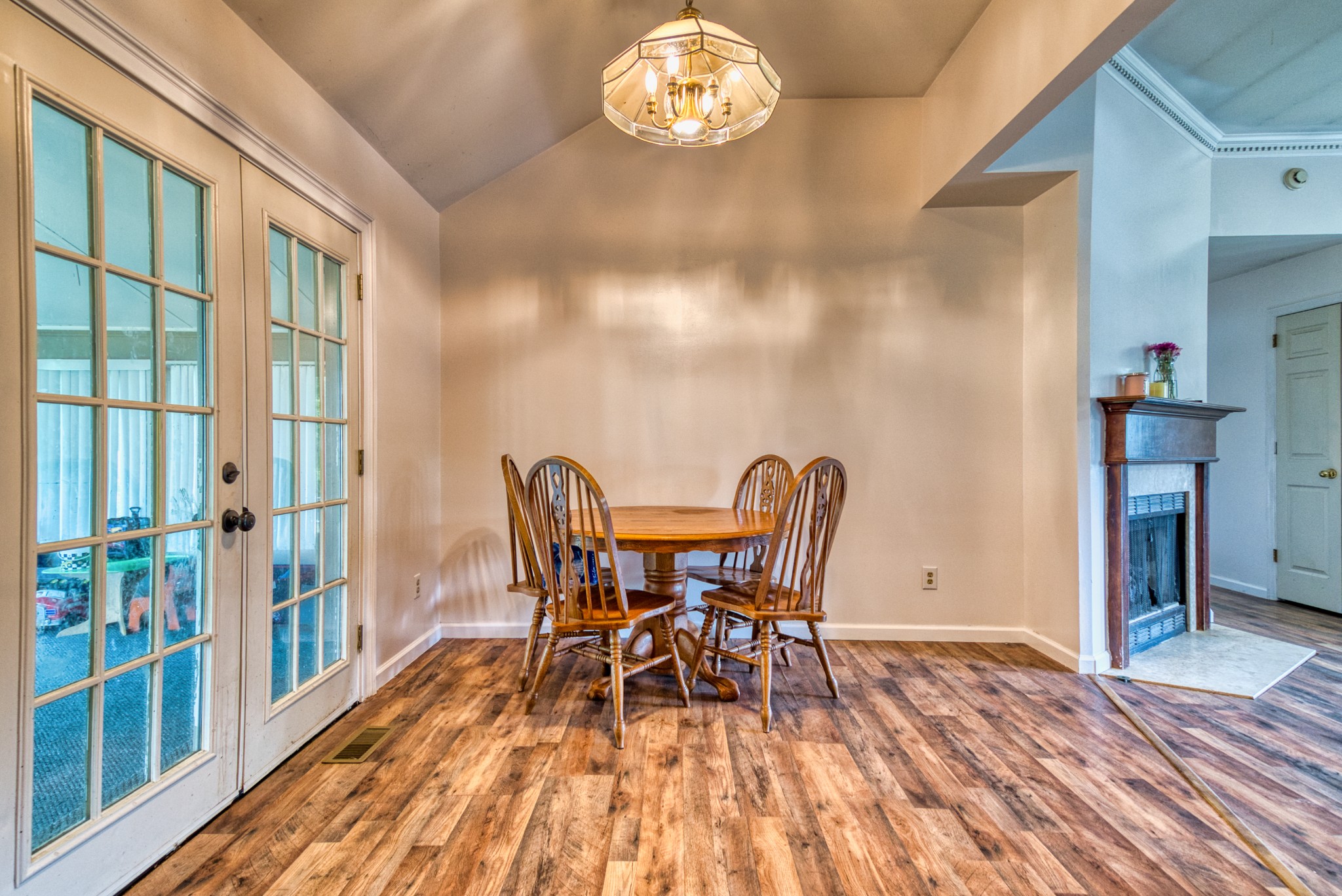 190 Rose Street Greenbrier, TN 37073 - Photo 20 of 32 a view of a dining room with furniture a chandelier and wooden floor