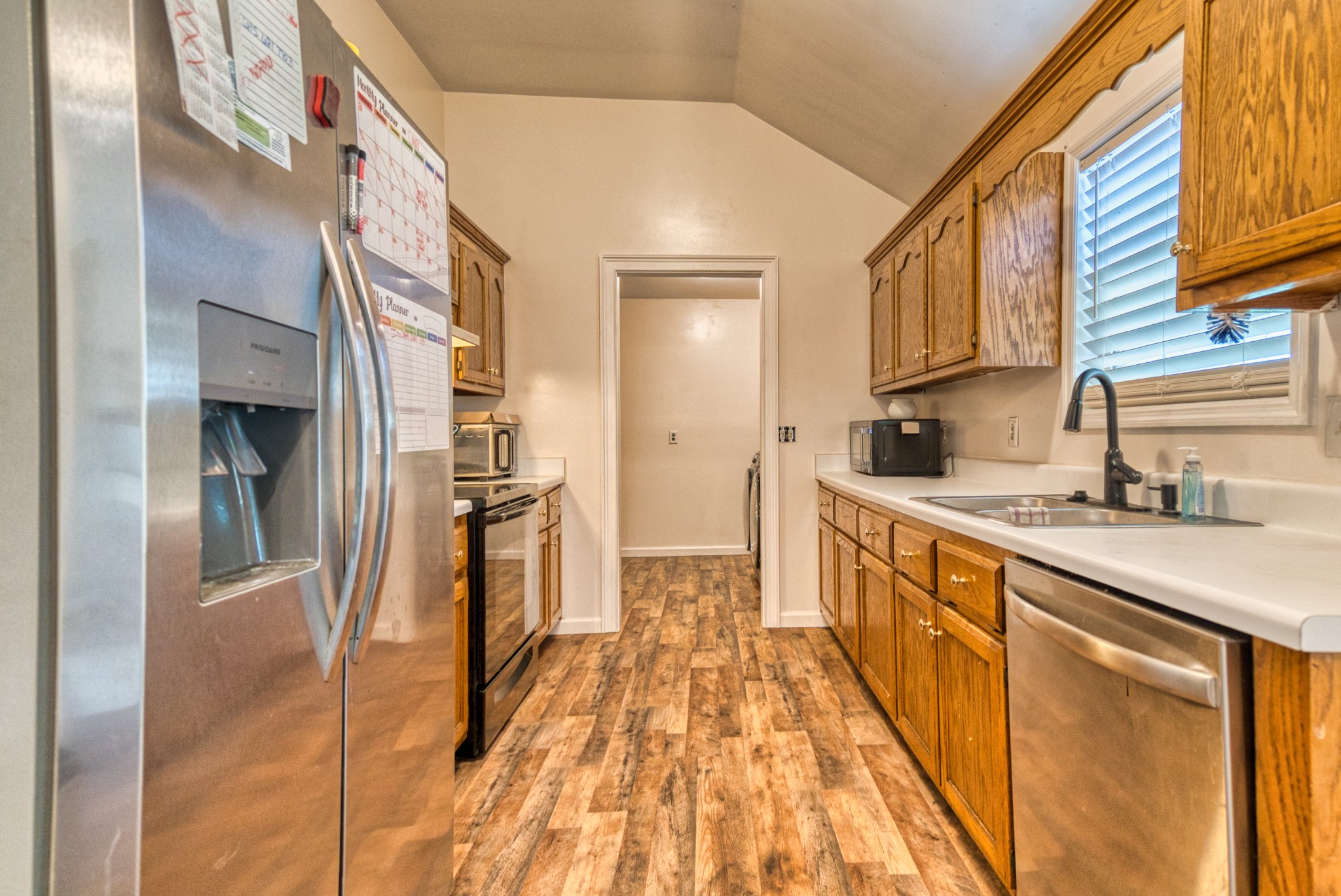 190 Rose Street Greenbrier, TN 37073 - Photo 22 of 32 a kitchen with stainless steel appliances granite countertop a refrigerator and a sink