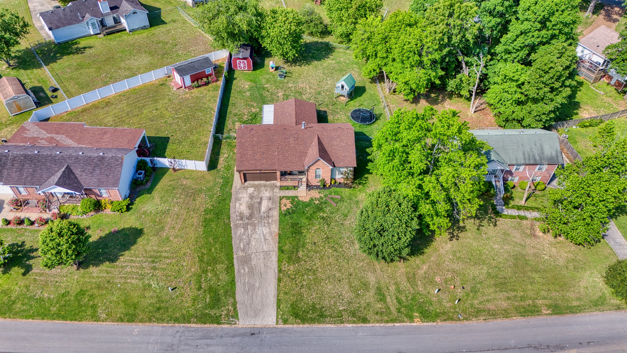 190 Rose Street Greenbrier, TN 37073 - Photo 28 of 32 an aerial view of a house with a yard and black garage