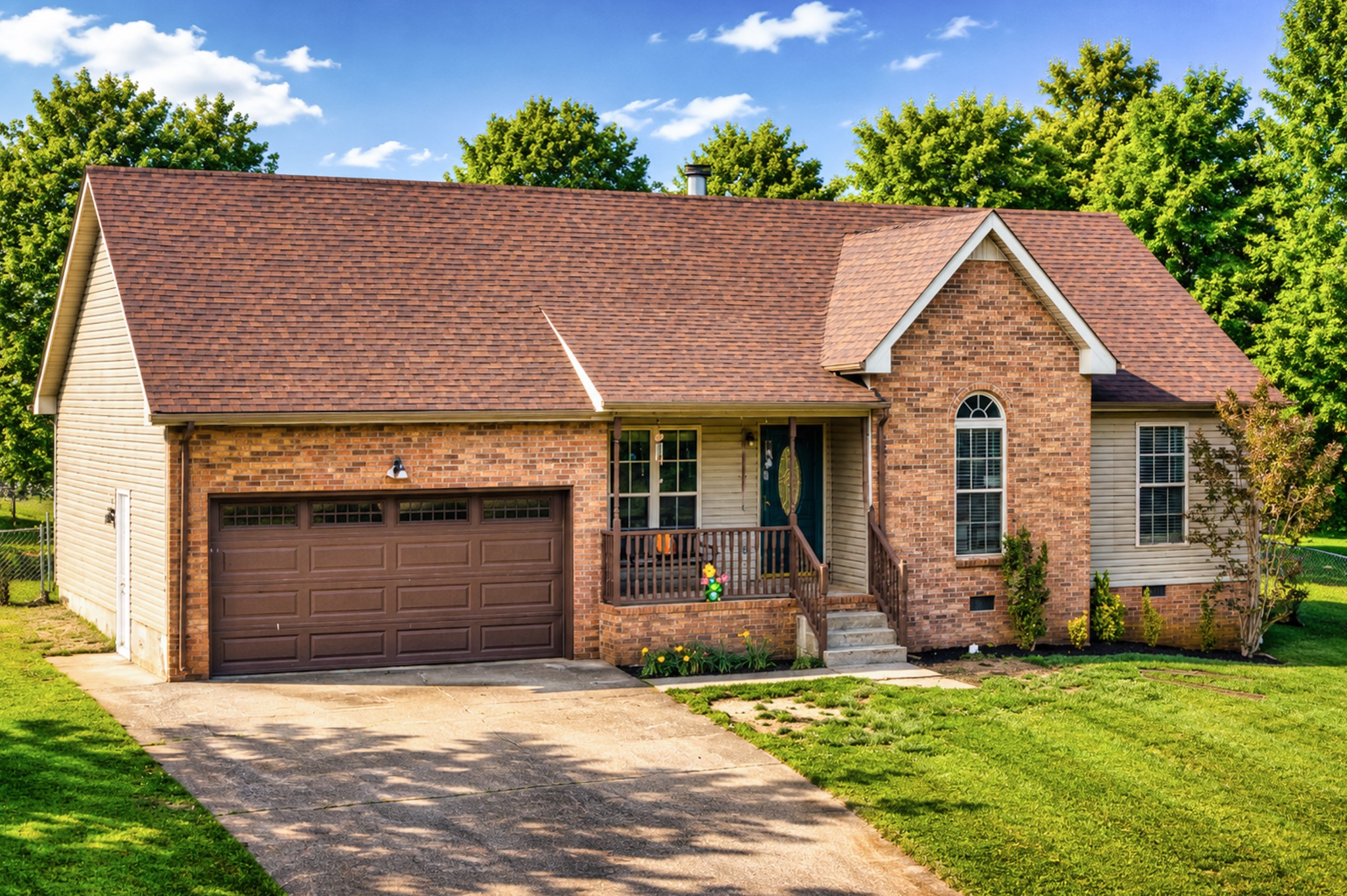 190 Rose Street Greenbrier, TN 37073 - Photo 3 of 32 a front view of a house with a garden