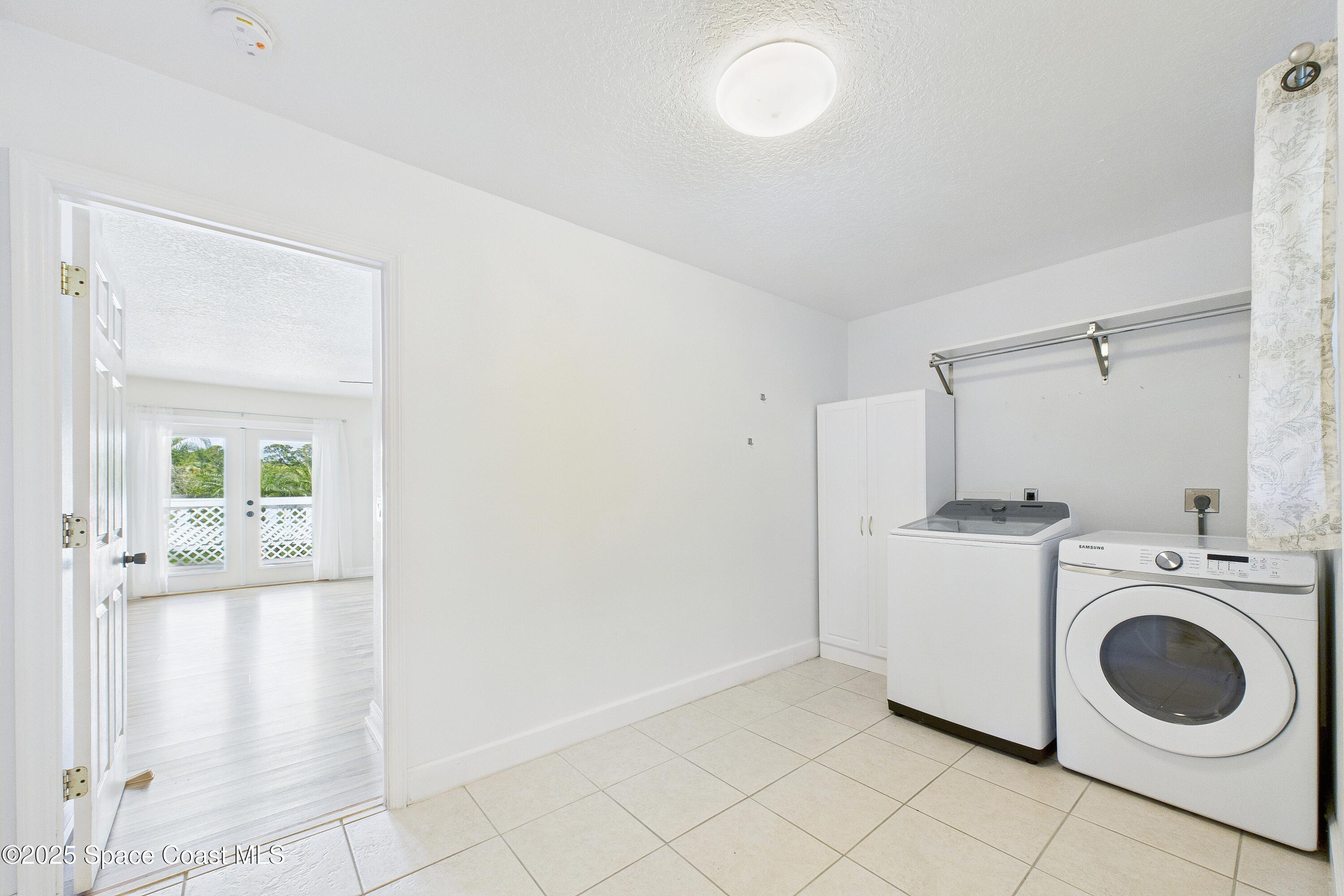 3435 Huggins Drive Malabar, FL 32950 - Photo 28 of 63 a utility room with sink dryer and washer