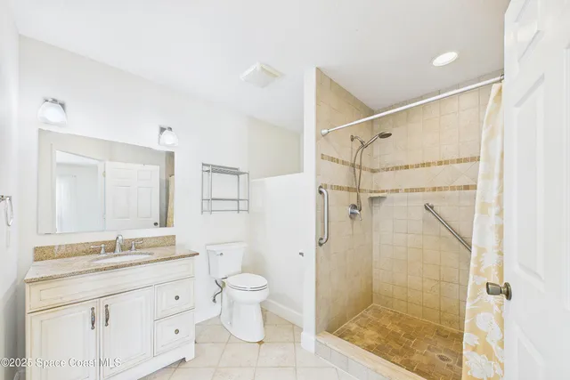 a view of a livingroom with a ceiling fan and window
