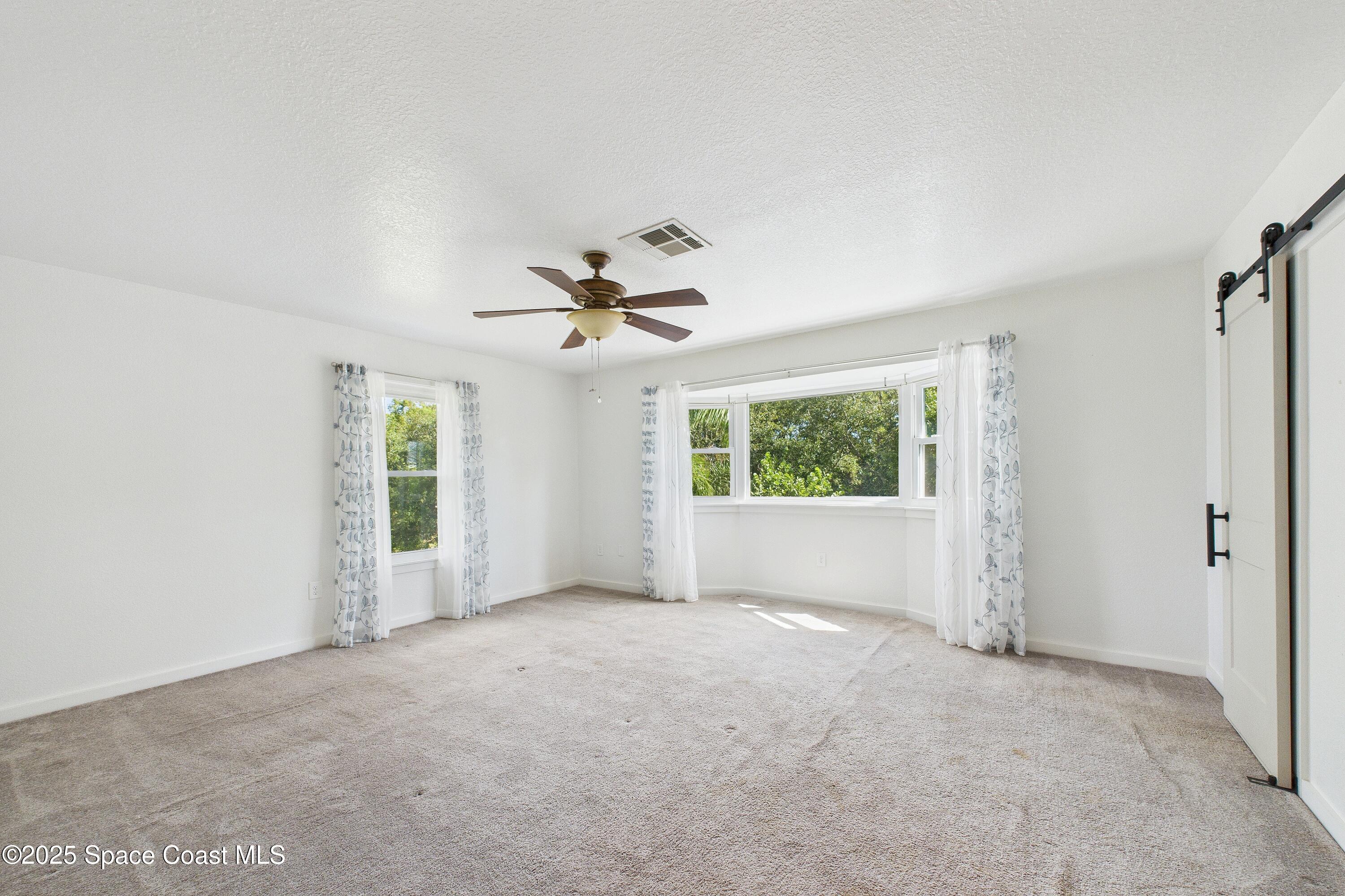3435 Huggins Drive Malabar, FL 32950 - Photo 38 of 63 a view of an empty room with a window