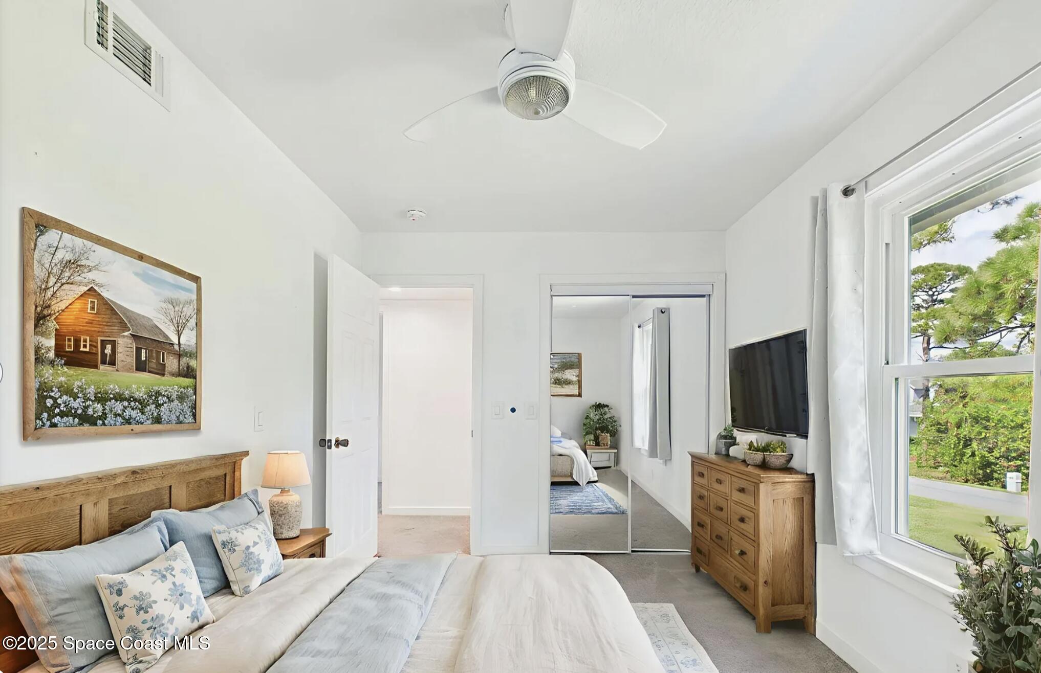 3435 Huggins Drive Malabar, FL 32950 - Photo 45 of 63 a bedroom with furniture and a flat screen tv