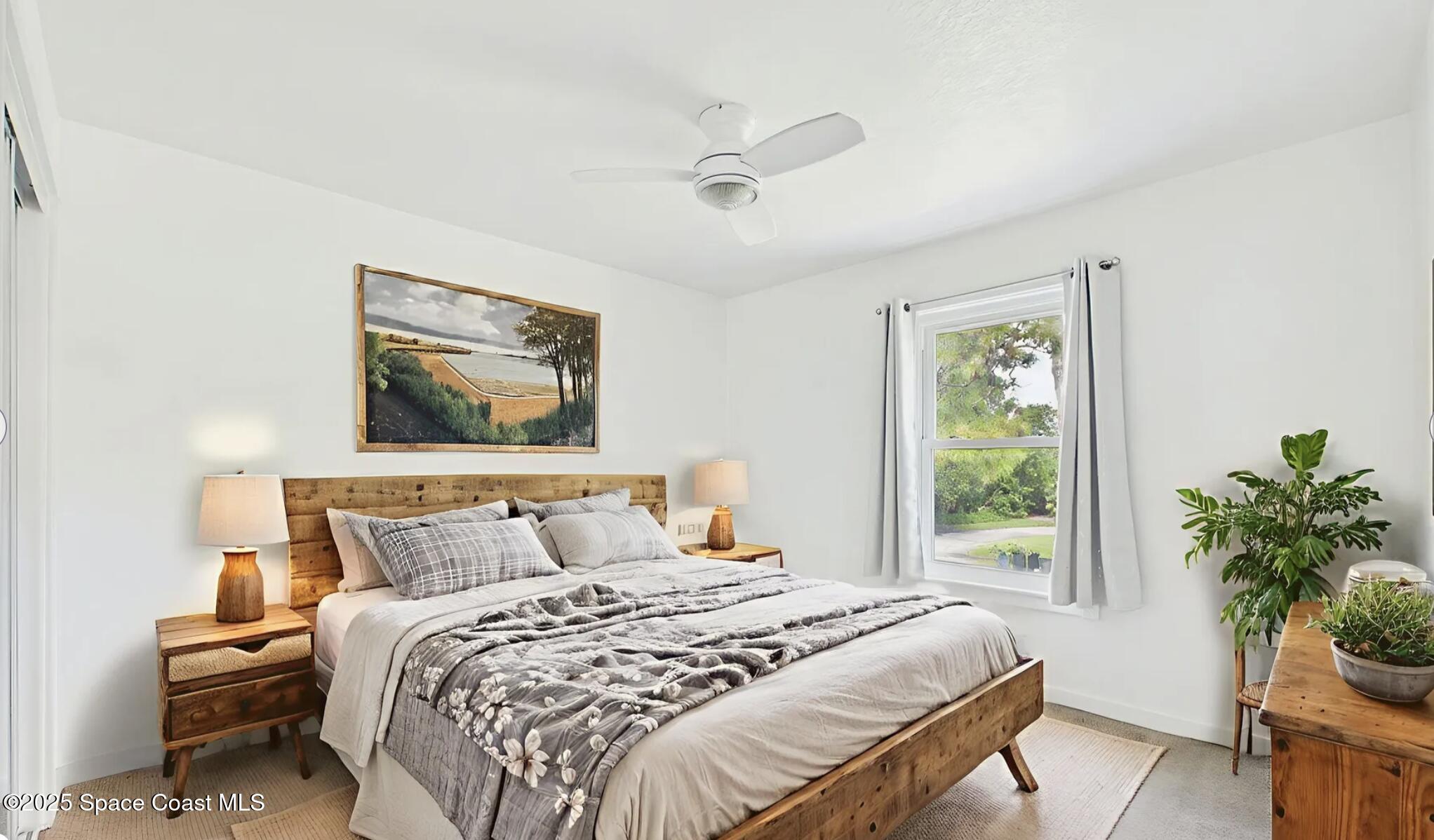 3435 Huggins Drive Malabar, FL 32950 - Photo 47 of 63 a bedroom with a bed and a window