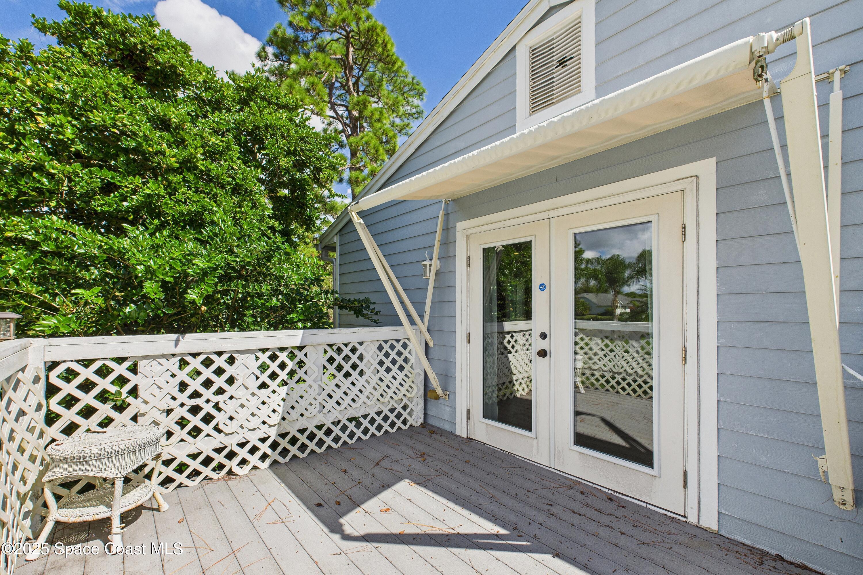 3435 Huggins Drive Malabar, FL 32950 - Photo 50 of 63 Private Porch Primary Bedroom