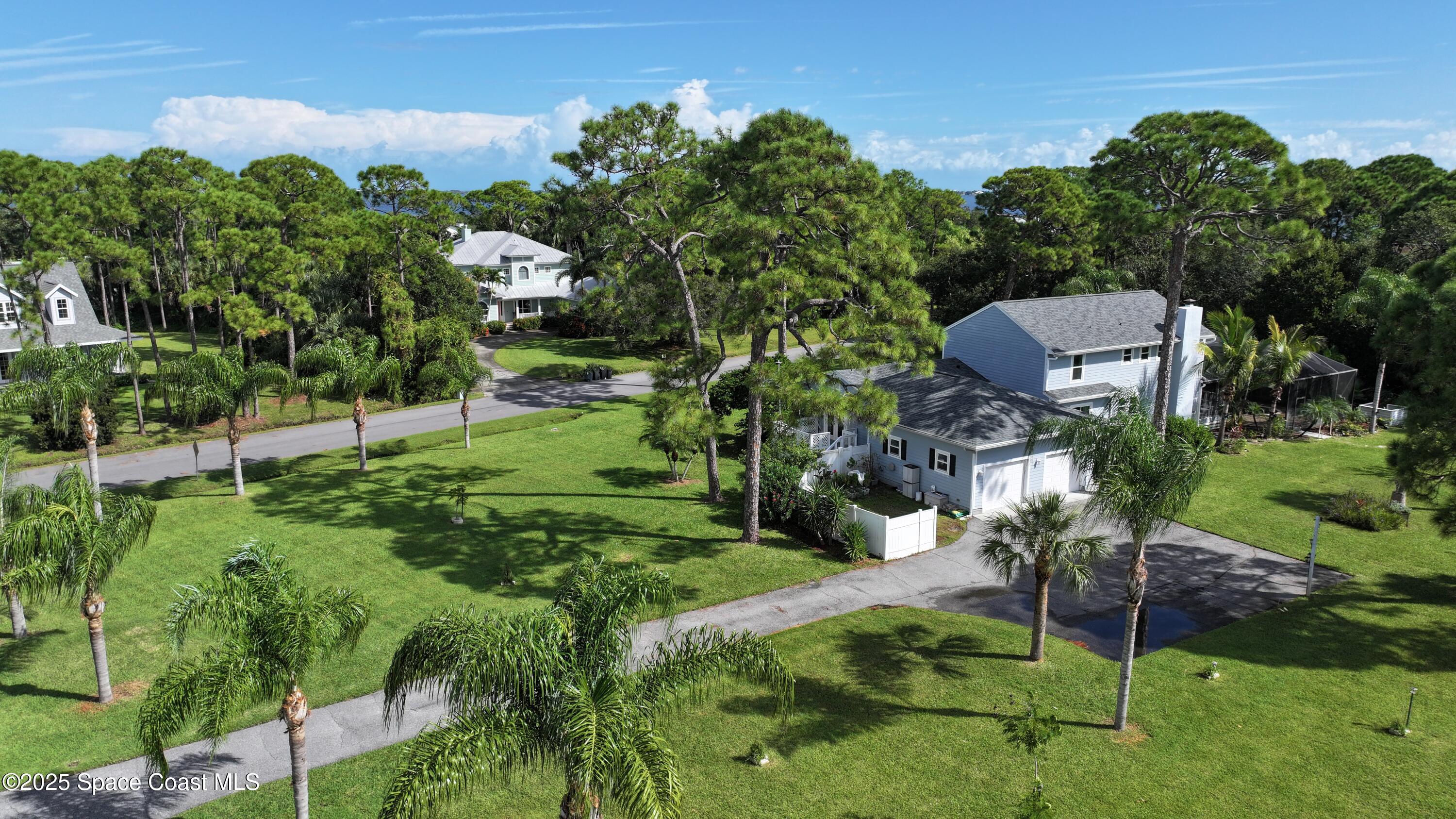 3435 Huggins Drive Malabar, FL 32950 - Photo 59 of 63 a backyard of a house with table and chairs