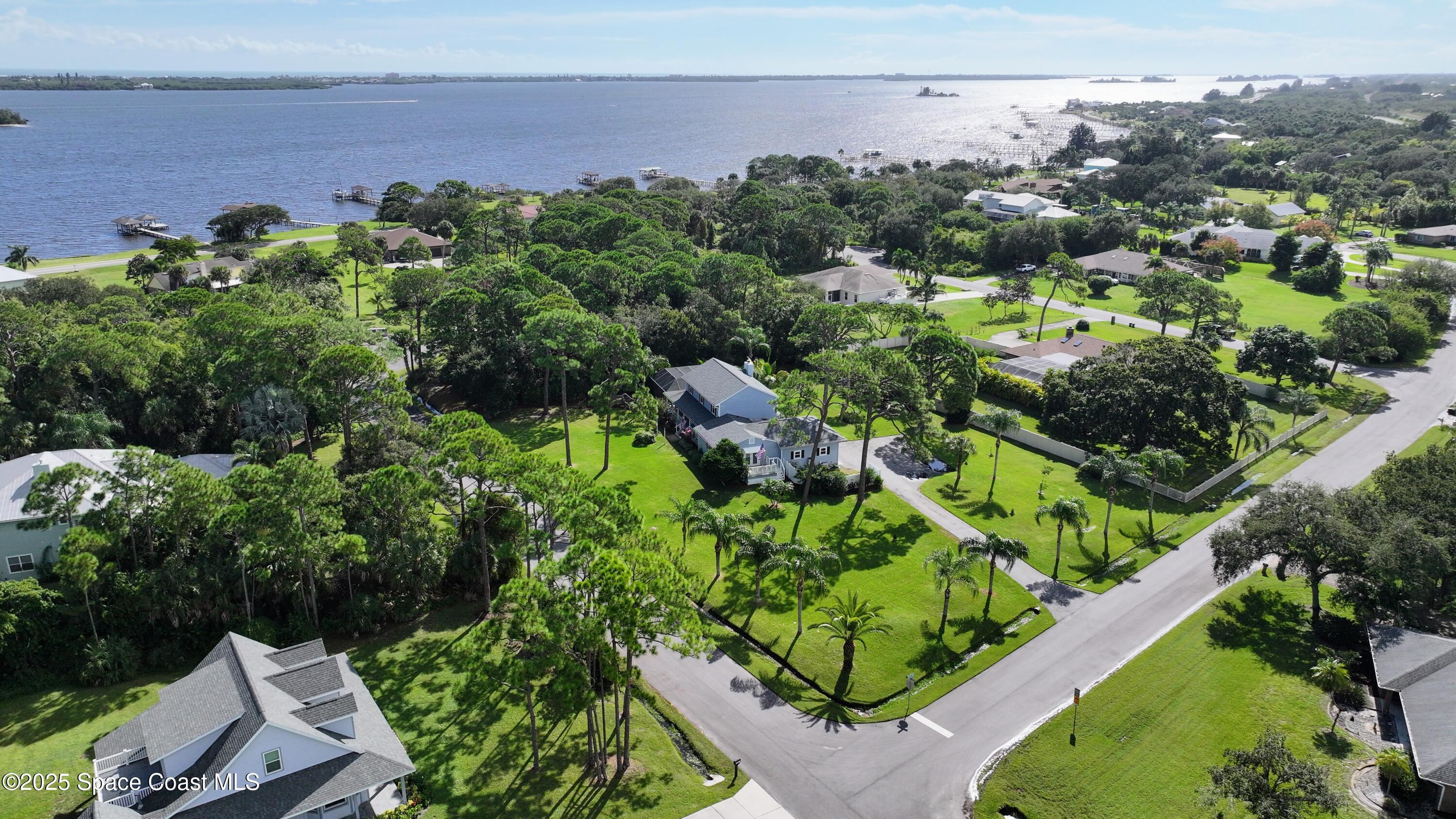 3435 Huggins Drive Malabar, FL 32950 - Photo 60 of 63 an aerial view of a house with a yard
