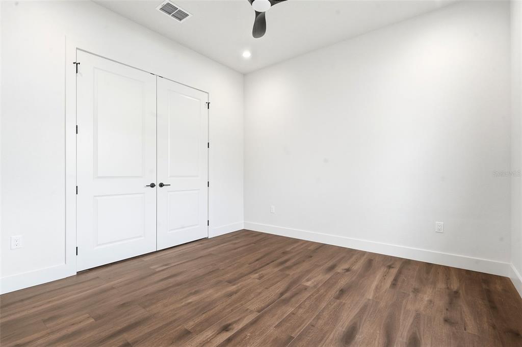 1615 Cole Road Orlando, FL 32803 - Photo 19 of 31 a view of an empty room with wooden floor