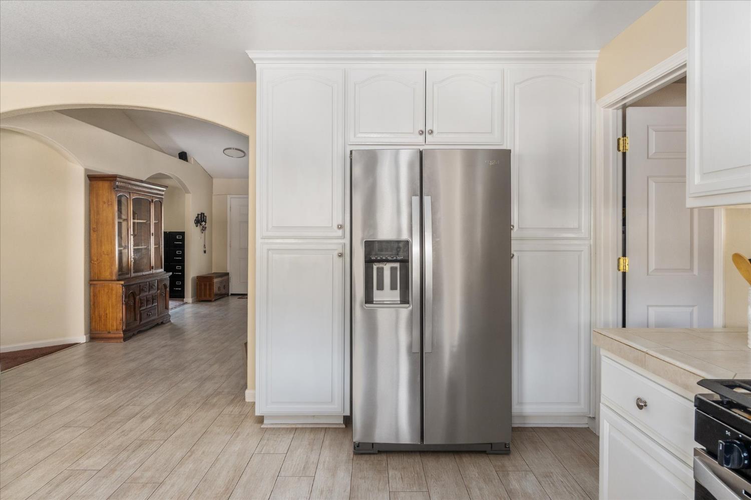 1284 Acorn Street Copperopolis, CA 95228 - Photo 12 of 62 a kitchen with stainless steel appliances granite countertop a refrigerator and a stove