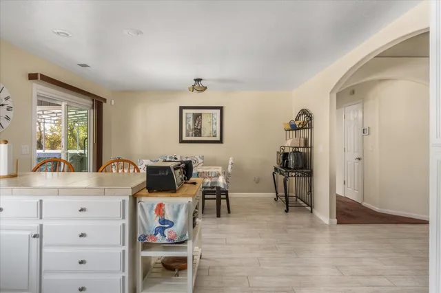 a bed room with a bed and a chair