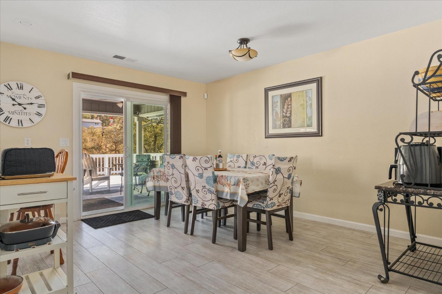 1284 Acorn Street Copperopolis, CA 95228 - Photo 16 of 62 a view of a dining room with furniture window and wooden floor