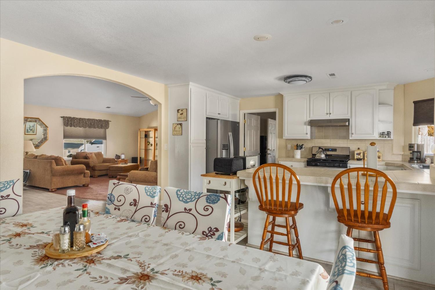 1284 Acorn Street Copperopolis, CA 95228 - Photo 17 of 62 a living room with furniture and a refrigerator