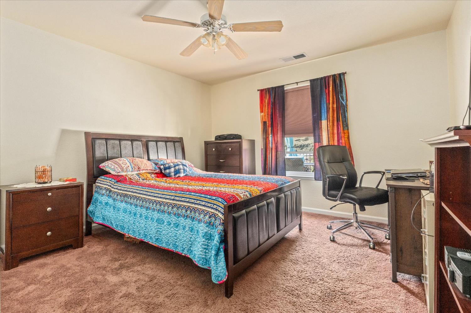 1284 Acorn Street Copperopolis, CA 95228 - Photo 22 of 62 a room with a bed and a chandelier