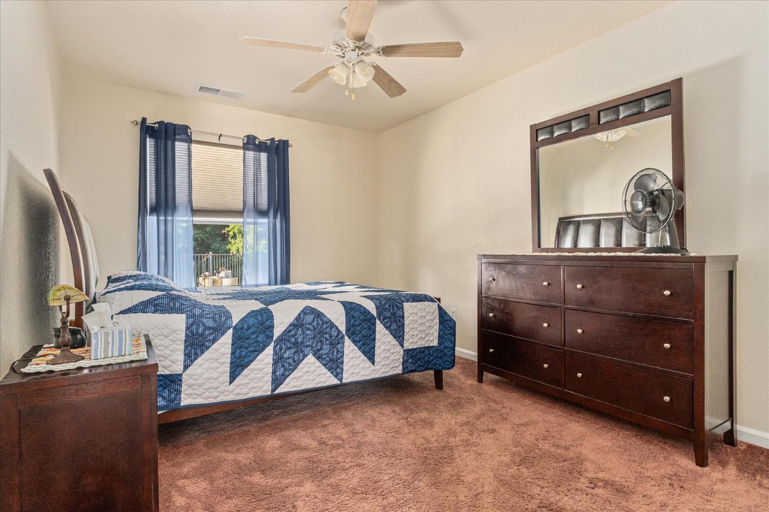 1284 Acorn Street Copperopolis, CA 95228 - Photo 23 of 62 a spacious bedroom with a bed window and wall painting