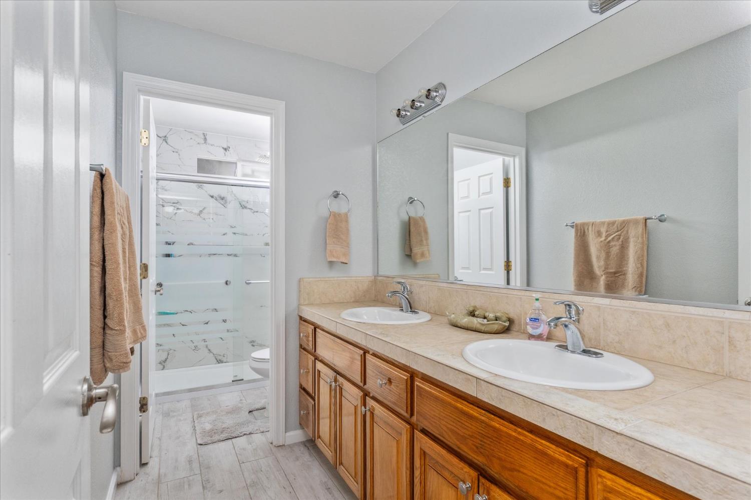 1284 Acorn Street Copperopolis, CA 95228 - Photo 24 of 62 a bathroom with a granite countertop sink mirror and double