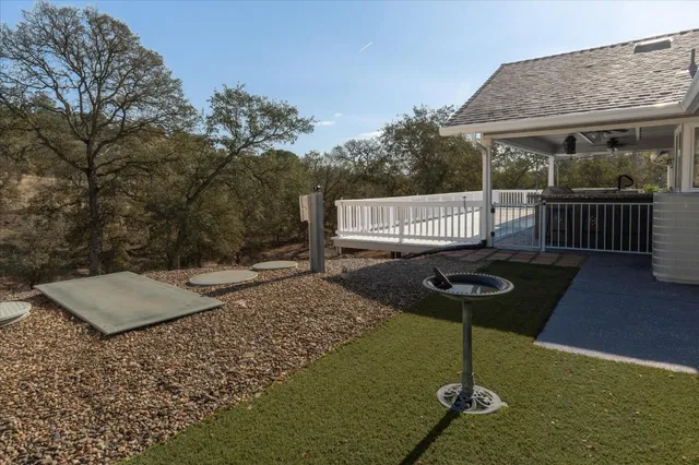 a view of a pathway with a wrought fence