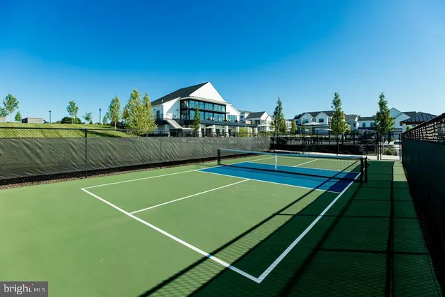 a view of an outdoor space and tennis court