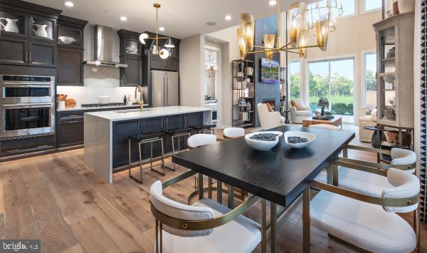 508 Trifecta Road, Unit 275 Downingtown, PA 19335 - Photo 33 of 44 a kitchen with a table chairs stove and kitchen view