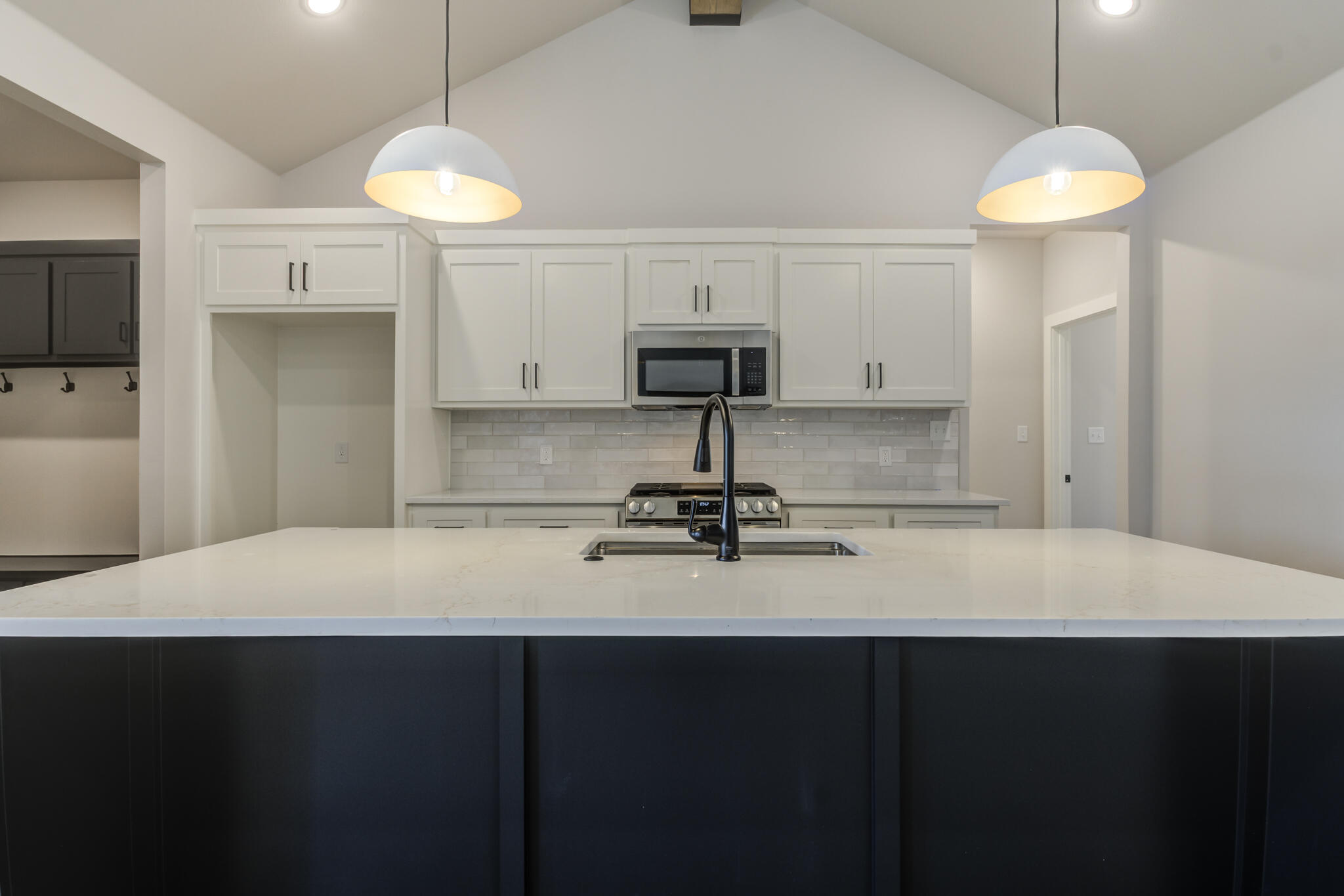 6914 13th Street Lubbock, TX 79416 - Photo 22 of 49 a kitchen with a sink a counter space and cabinets