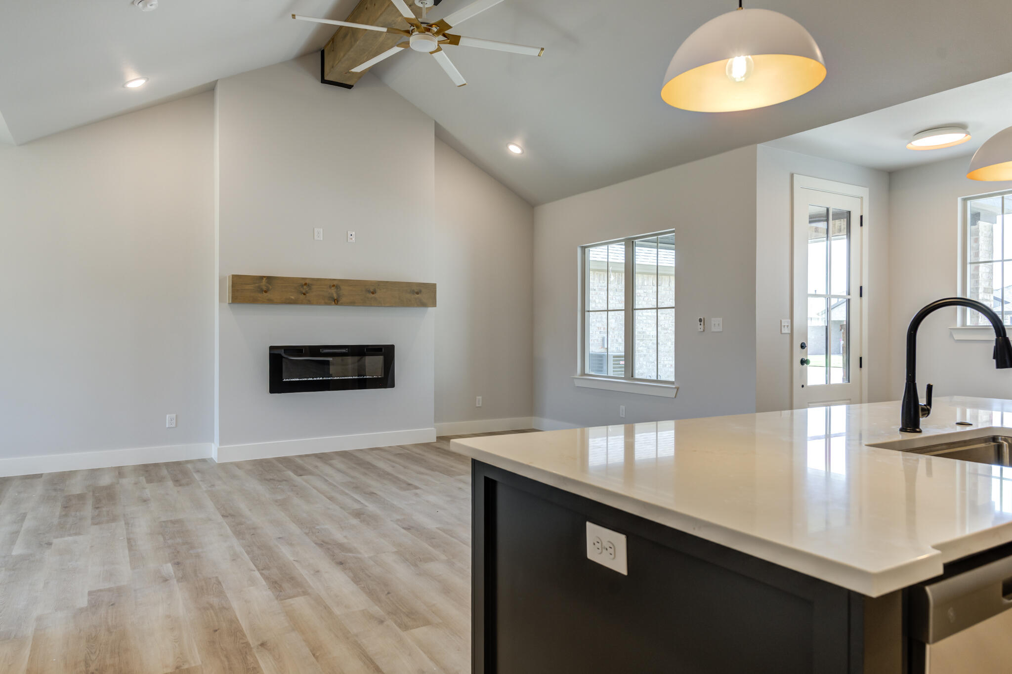 6914 13th Street Lubbock, TX 79416 - Photo 33 of 49 a kitchen with kitchen island a sink stainless steel appliances and a counter top space