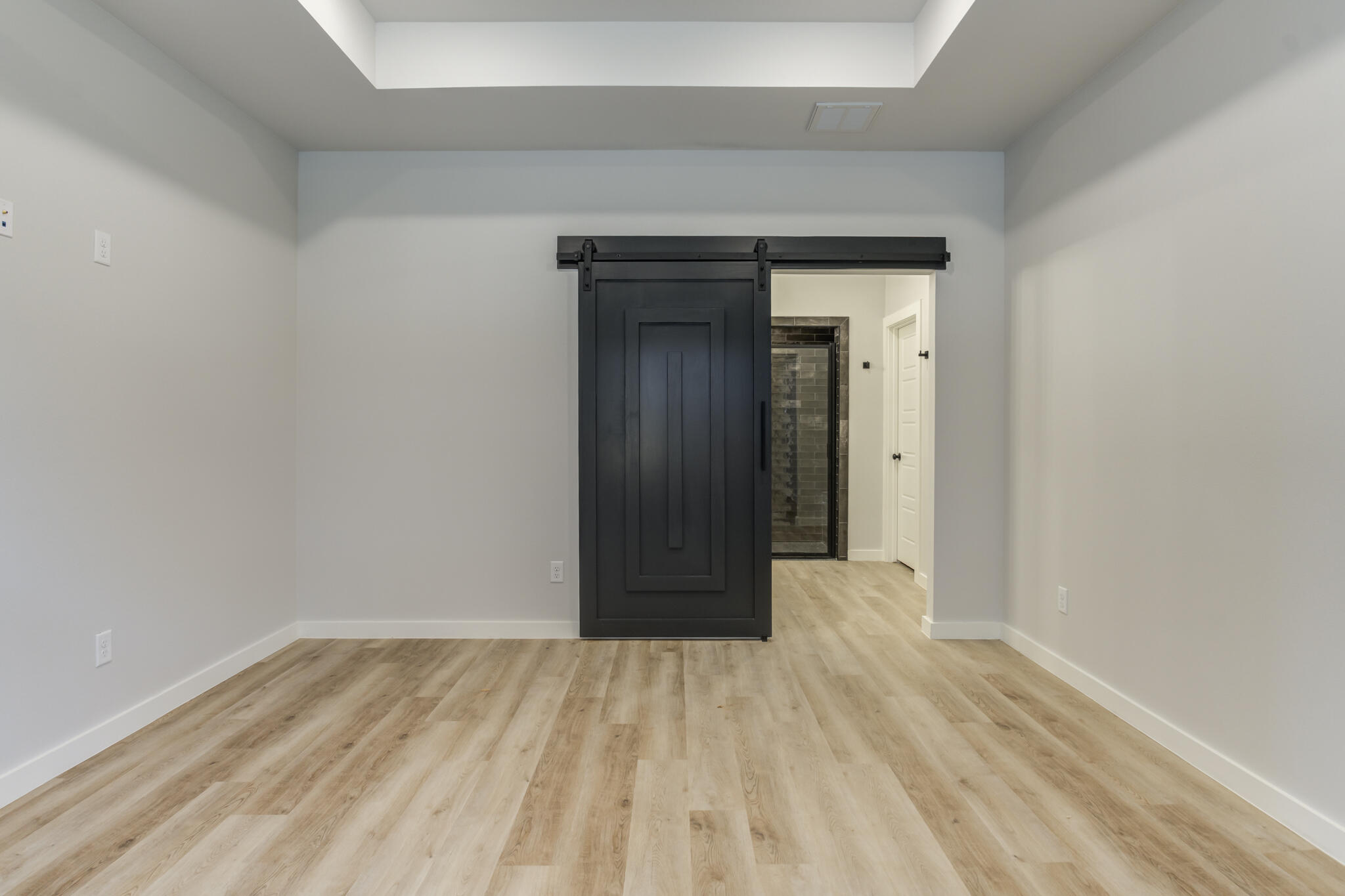 6914 13th Street Lubbock, TX 79416 - Photo 37 of 49 a view of an empty room with wooden floor