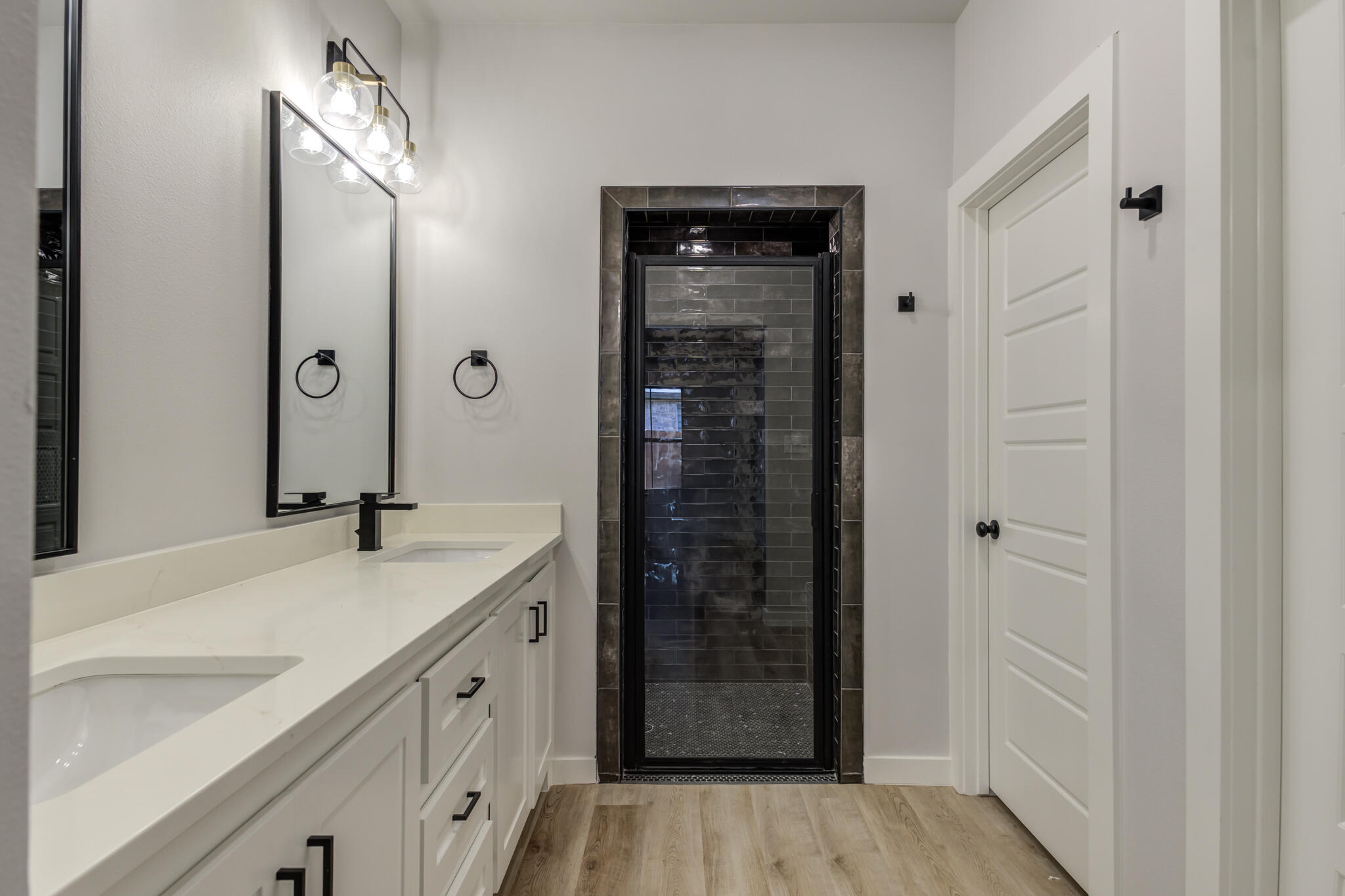 6914 13th Street Lubbock, TX 79416 - Photo 39 of 49 a bathroom with a sink and a mirror with shower