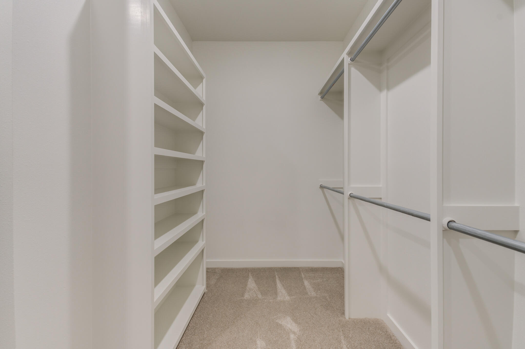 6914 13th Street Lubbock, TX 79416 - Photo 42 of 49 a view of walk in closet with empty racks