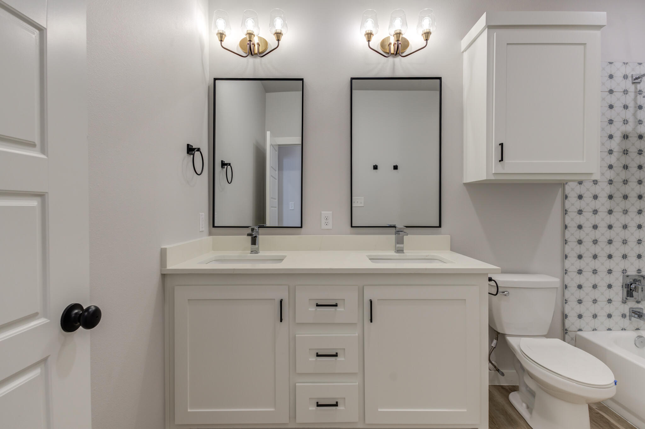 6914 13th Street Lubbock, TX 79416 - Photo 45 of 49 a bathroom with a granite countertop sink and a toilet