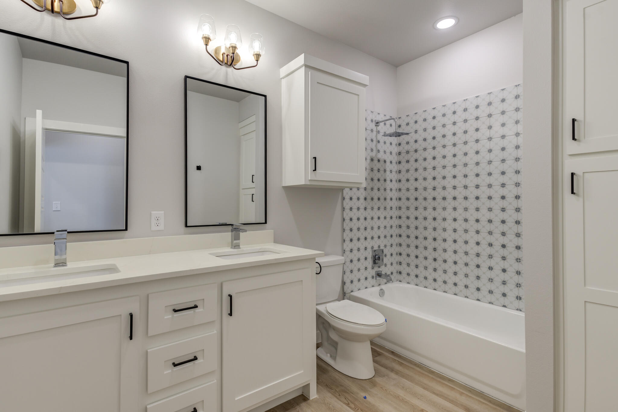 6914 13th Street Lubbock, TX 79416 - Photo 46 of 49 a bathroom with a granite countertop sink toilet and shower