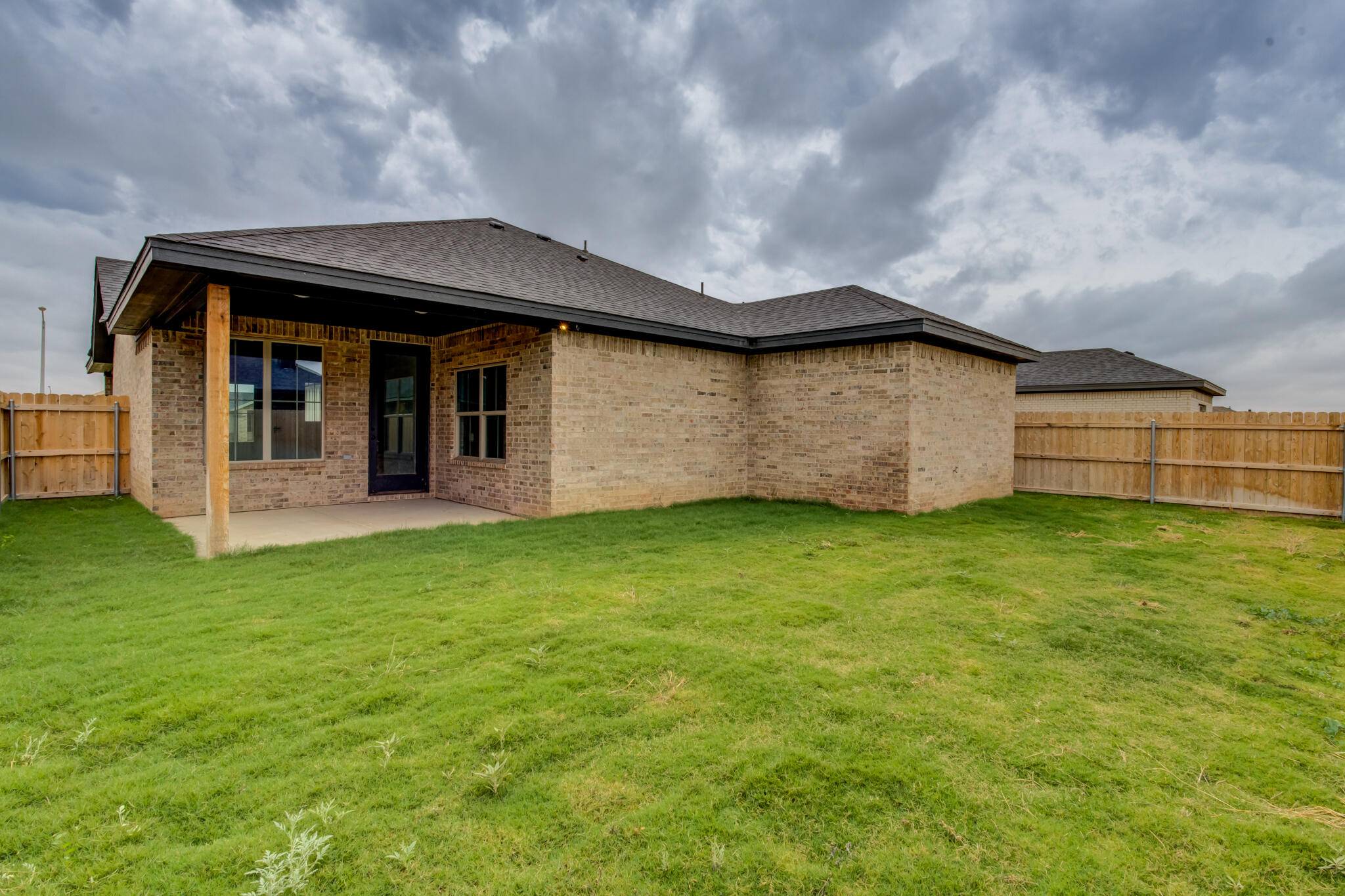 6914 13th Street Lubbock, TX 79416 - Photo 49 of 49 a front view of a house with a garden