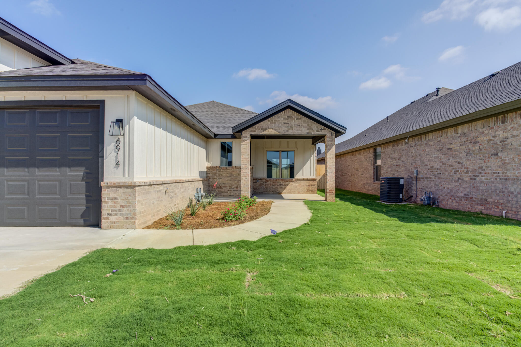 6914 13th Street Lubbock, TX 79416 - Photo 8 of 49 a view of a house with a backyard and porch