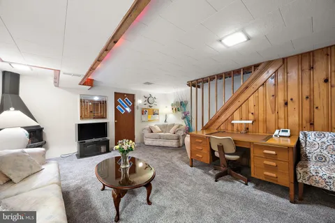 a living room with furniture and a dining room