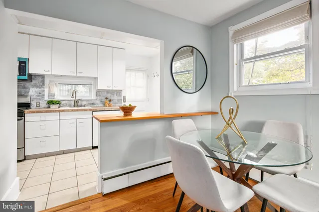 a kitchen with stainless steel appliances granite countertop a sink a stove and cabinets