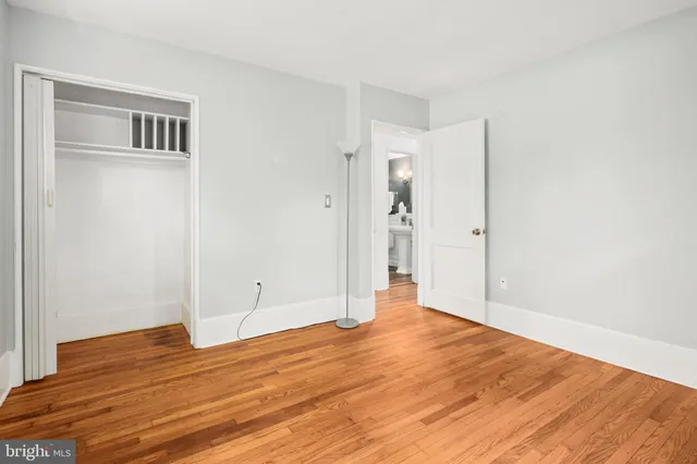 a bedroom with a bed and a table in it