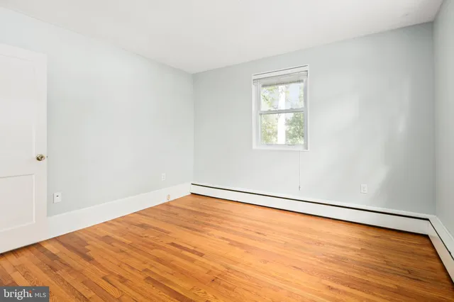 a bedroom with a bed and a table in it