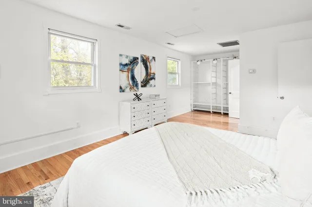 a bathroom with a granite countertop sink a vanity and a mirror